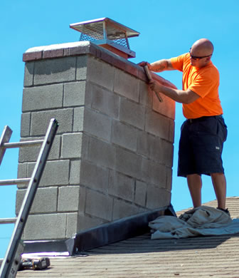 Kenny crafting a fine chimney